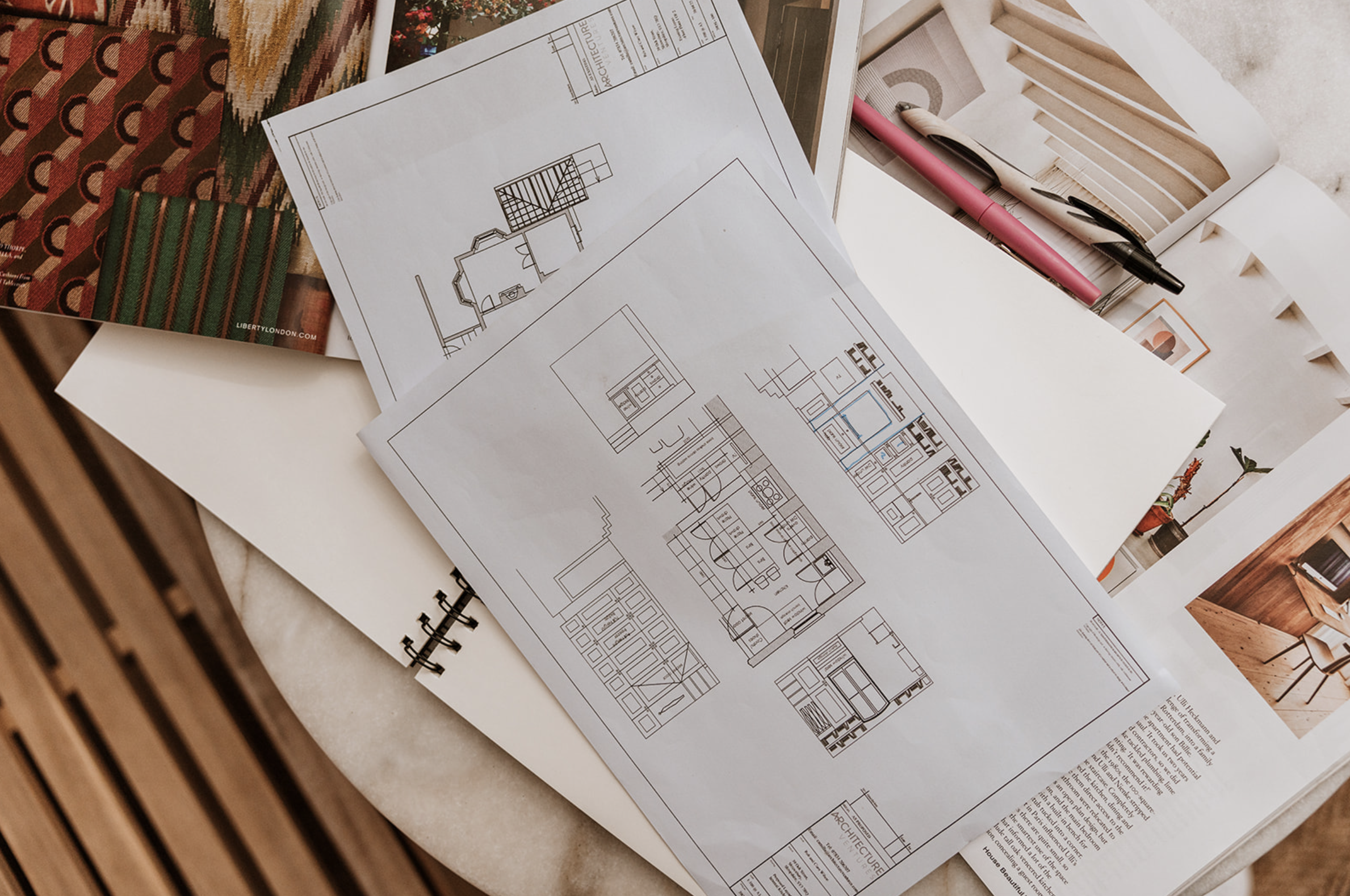 Architecture Ventures floor plans and elevations laid out with fabric and material samples
