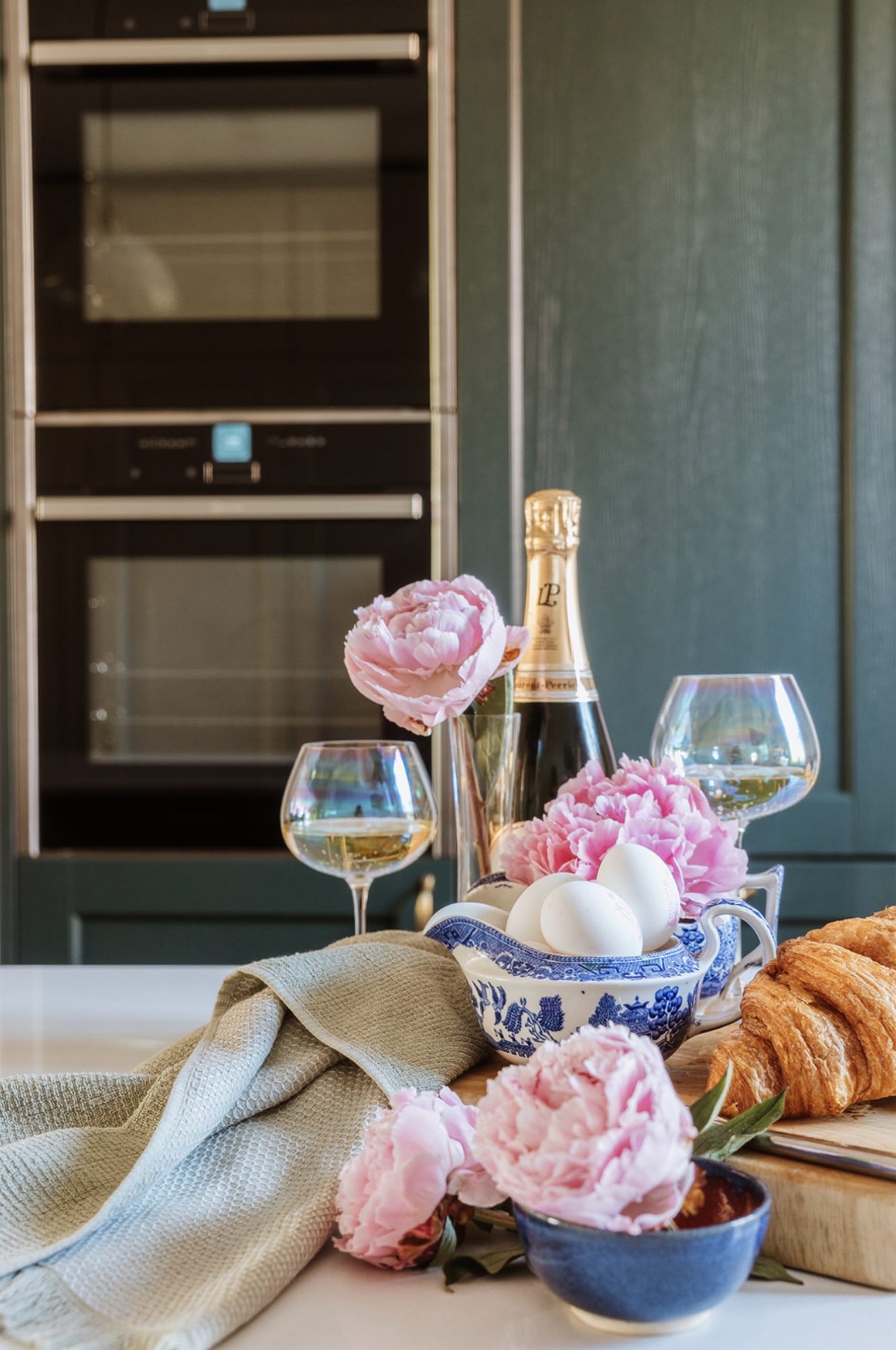 Flowers, breakfast and glassware styled on the Oak Street kitchen island