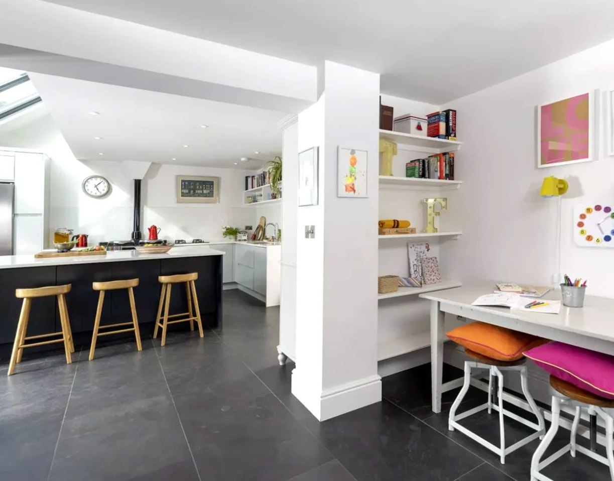 Looking back through the Oakleigh House extension towards the original kitchen, with a retained structural pillar and built-in shelving